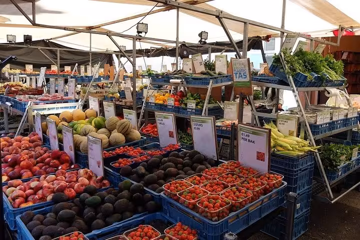 Vibrant fresh produce at a bustling Bordeaux market, showcasing local fruits and vegetables on the Old Town & Market Food Tour.