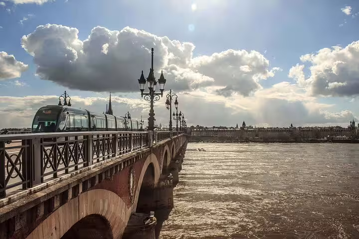 Tram crossing Pont de Pierre over the Garonne River, clue stop on a self-guided Bordeaux e-scavenger hunt
