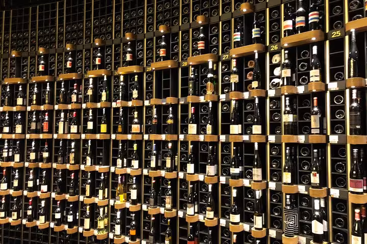 Extensive wine collection displayed in Bordeaux cellar, showcasing the region's renowned wine heritage on a food tour.