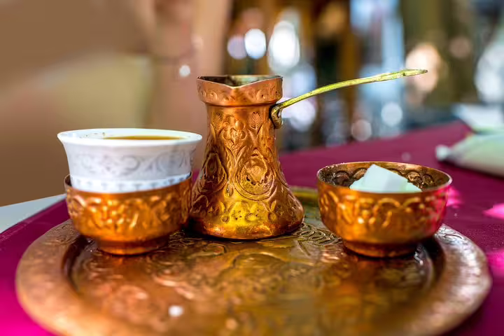 Traditional Bosnian coffee set in copper cezve and cups, a cultural stop on the Mostar day trip from Makarska