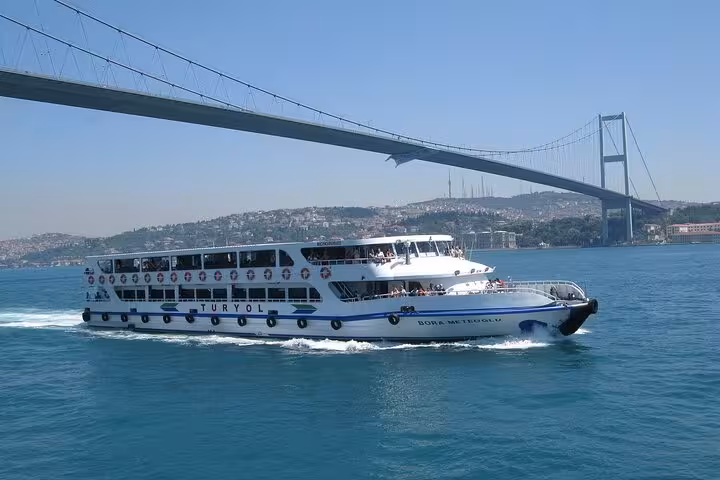 Bosphorus cruise ferry sailing under the Bosphorus Bridge in Istanbul, highlight of a 3 nights 4 days city break