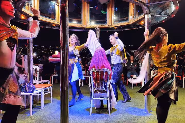 Turkish folk dance performance on Bosphorus dinner cruise with private table seating and live entertainment