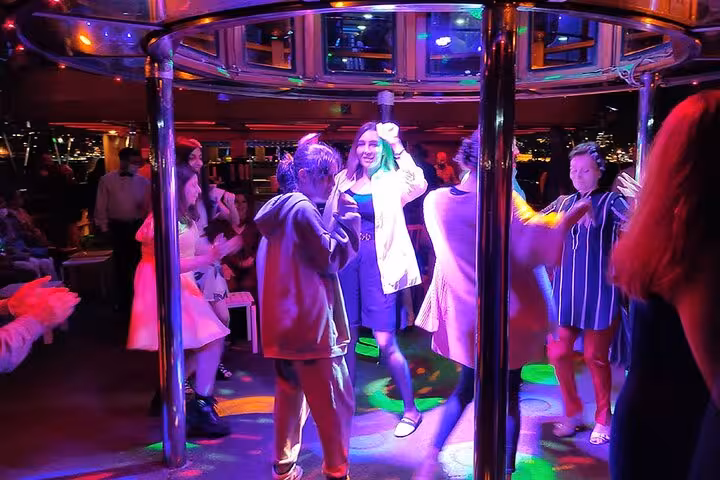 Guests dining at private tables on Bosphorus dinner cruise in Istanbul with Turkish show and onboard bar service