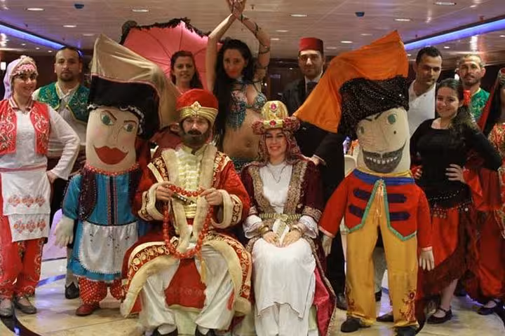 Turkish night performers and Ottoman costumes on Bosphorus dinner cruise, group photo with private table guests