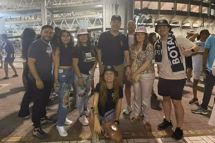 Botafogo fans and local guide meet outside the stadium in Rio de Janeiro before a matchday experience