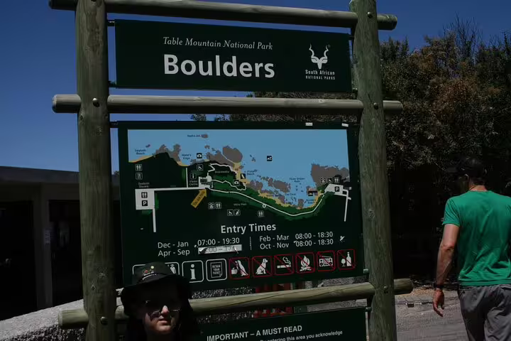Entrance sign for Boulders Beach at Table Mountain National Park, featuring penguin colony tour details.