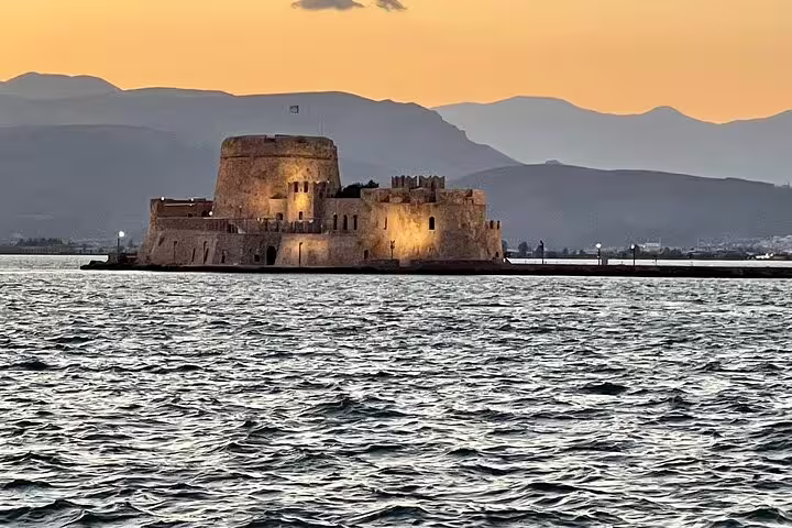 Bourtzi Castle in Nafplio at sunset, scenic highlight on Mycenae Corinth Canal Nafplio private tour