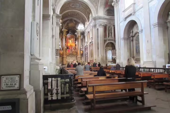 Elegant interior of Braga's historic church, showcasing intricate architecture on a half-day tour from Porto.