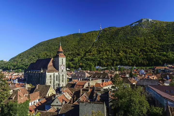 Aerial view of Brasov Old Town with Black Church and Tampa Mountain in background, Romania