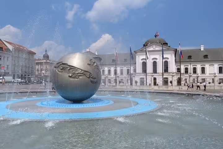 Bratislava fountain with globe sculpture in Old Town square, popular stop on Budapest to Vienna transfer tour