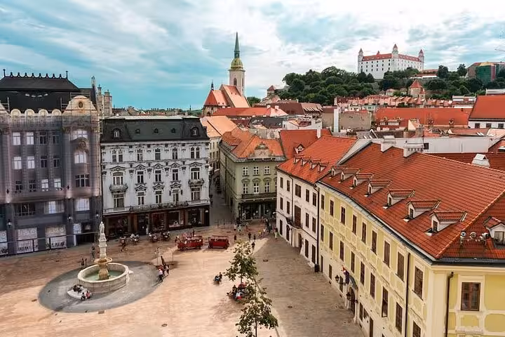 Bratislava Old Town square with fountain and red roofs, ideal stop on a private tour from Vienna