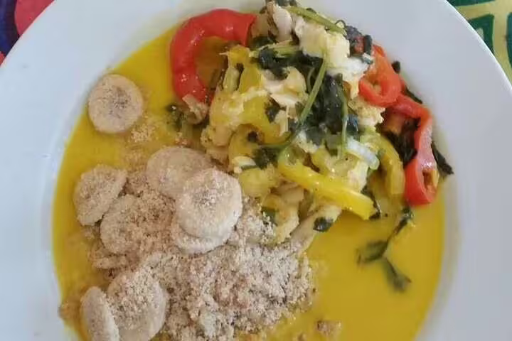 Authentic Brazilian dish with colorful vegetables and farofa served at a cooking class in Rio de Janeiro.