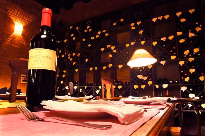 Cozy Brazilian diner with a bottle of wine, warm lighting, and rustic decor, perfect for an authentic dining experience.