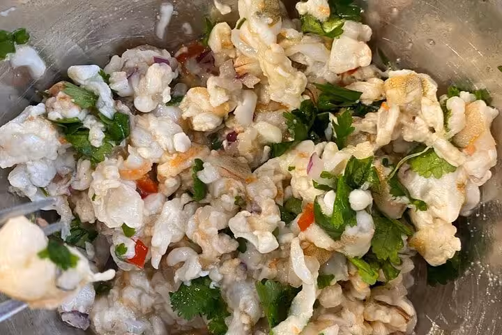 Colorful seafood mix with herbs and spices, ready for a delicious cooking class in Rio.