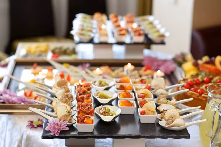 Elegant Brazilian street food assortment with colorful appetizers and small bites beautifully arranged on a table.