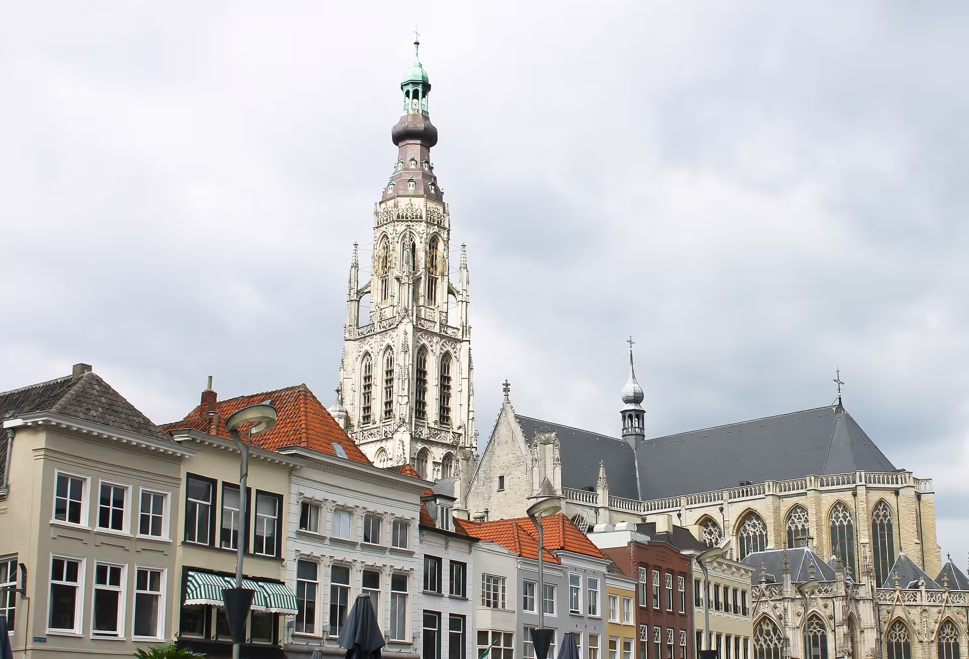 Breda Grote Kerk tower above historic city center rooftops, key stop on 1-day walking tour audioguide