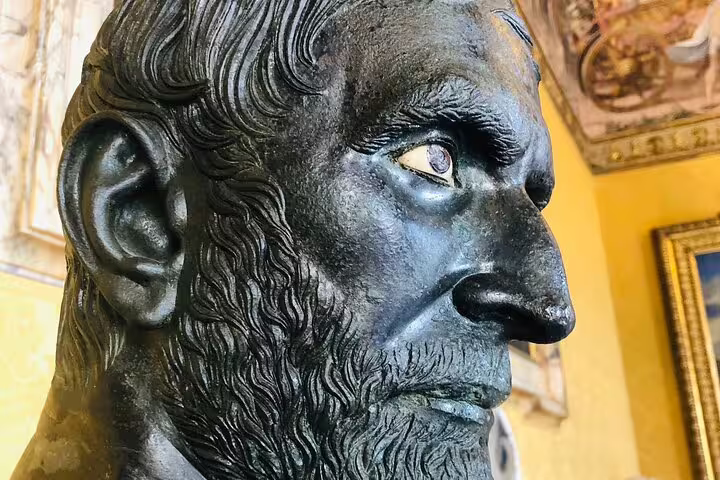 Close-up of ancient bronze bearded philosopher statue in Rome Capitoline Museums during private guided cultural tour