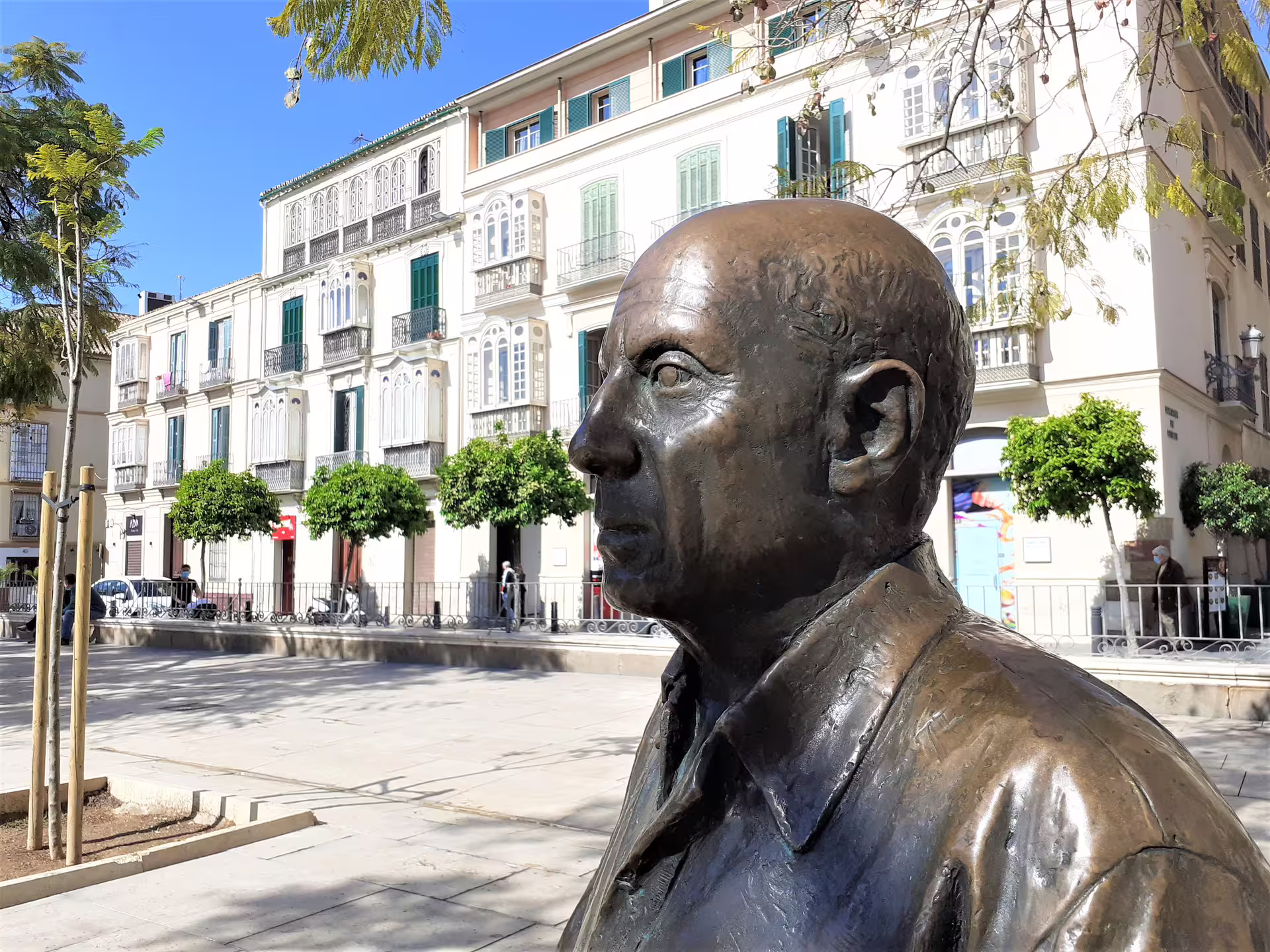Bronze statue in Malaga old town square on a private tour from Marbella, Andalusia cultural highlights