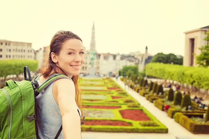 Woman exploring Mont des Arts in Brussels on a private tour with a beer stop, showcasing city highlights and hidden gems.