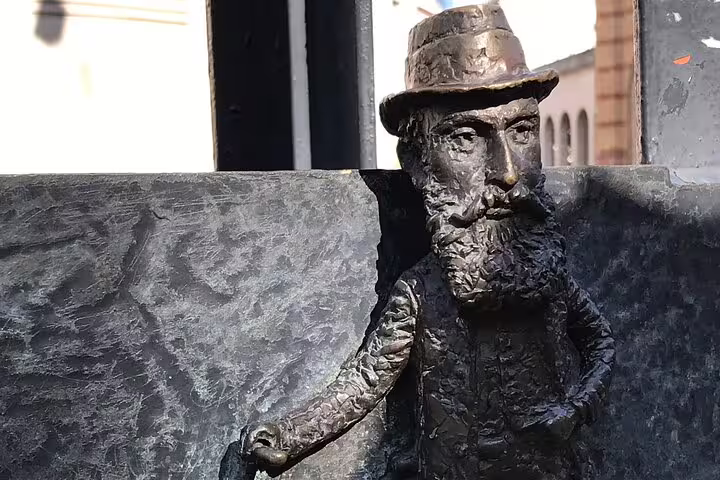 Close-up of a quirky bronze mini statue in Budapest, a fun photo stop on the street art walking tour