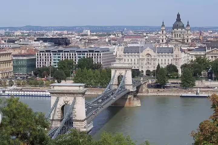 Scenic view of Budapest's Chain Bridge over the Danube River, ideal for a private day trip from Vienna, showcasing historic architecture.