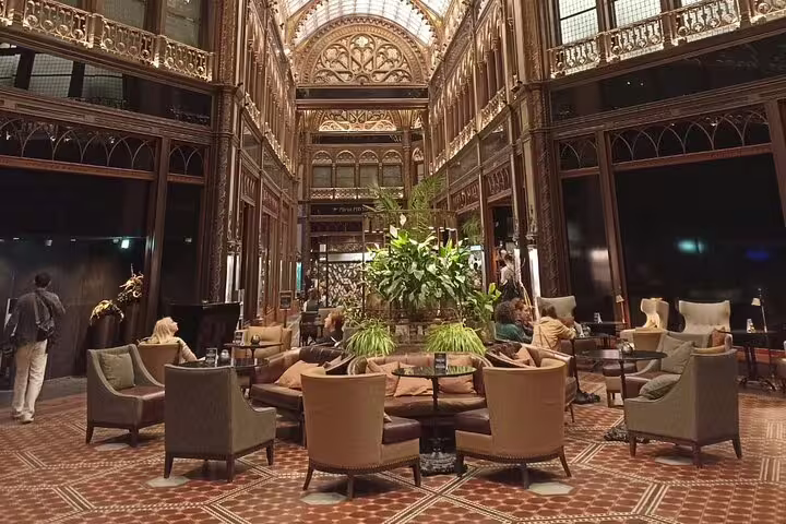Elegant Budapest café atrium with ornate ironwork, a stylish highlight on Private City Tour Budapest Modern
