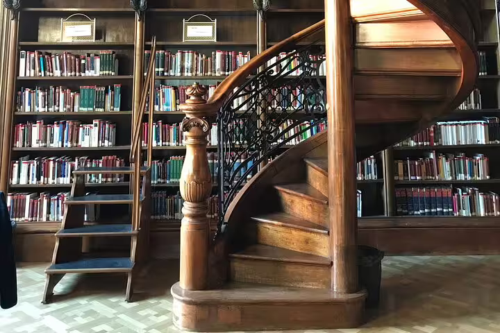 Historic Budapest library with wooden spiral staircase, featured stop on Private City Tour Budapest Modern