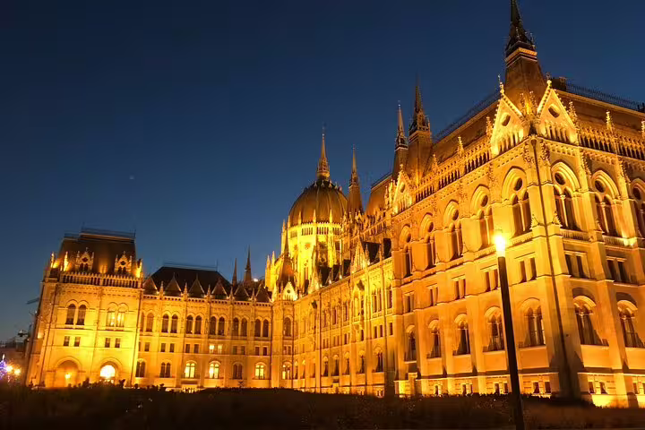 Budapest Parliament Building illuminated at night on a private city tour of unexpected hidden gems