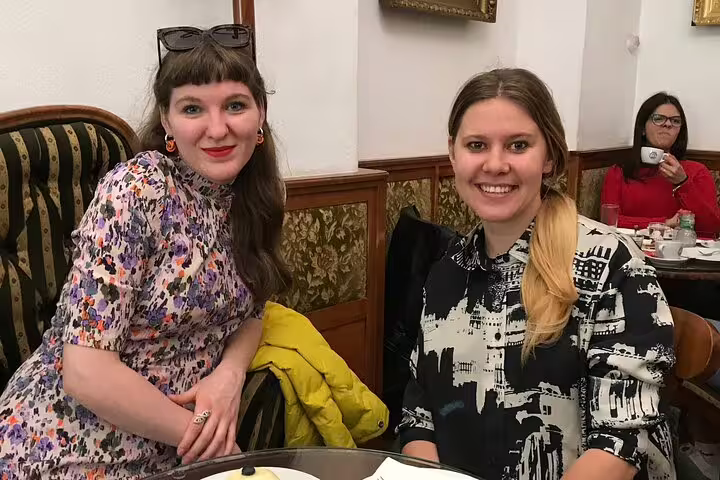 Guests enjoying a cozy Budapest café stop on an Unexpected Treasures of the City private tour experience