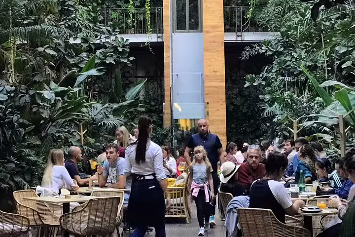 Lush courtyard seating at a Budapest ruin bar, ideal atmosphere for a self-guided ruin bars walking tour stop