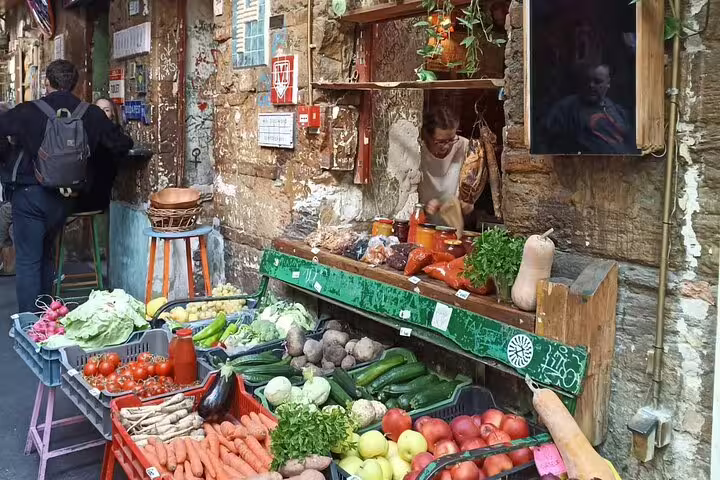 Budapest ruin bar market stall with fresh vegetables and rustic walls, stop on a self-guided ruin bars tour