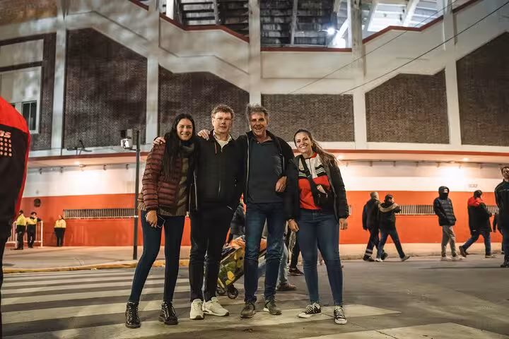Group photo outside Buenos Aires football stadium before kickoff on local matchday experience with fans