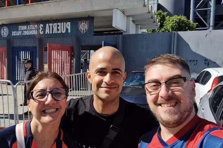 Travelers meet local host outside Buenos Aires stadium entrance before Argentine soccer matchday experience