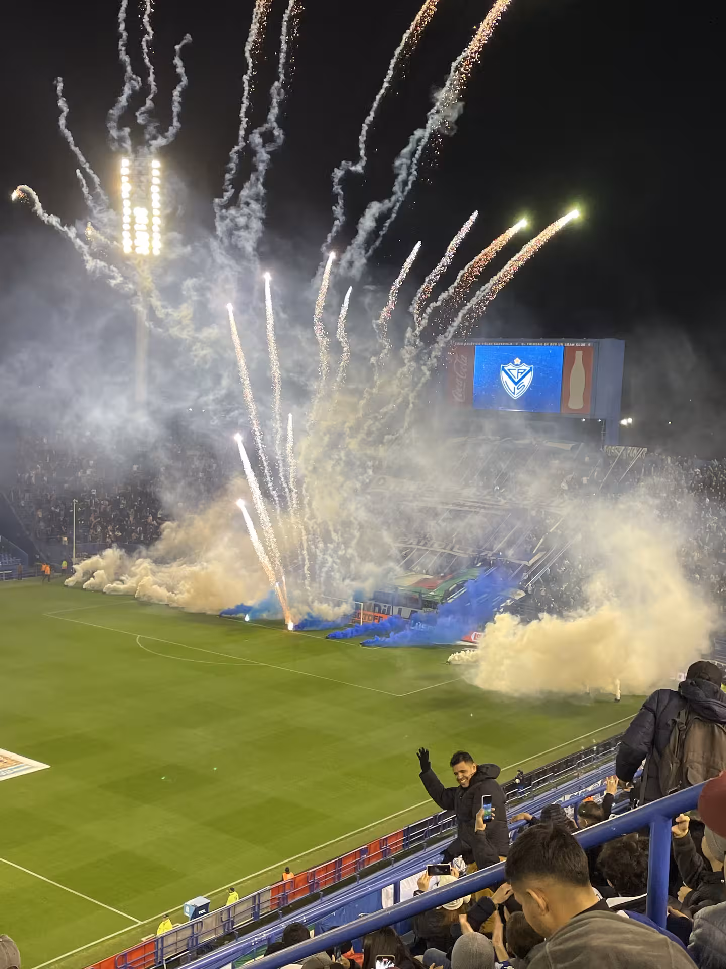 Fireworks and smoke fill Buenos Aires stadium during Argentine league matchday experience with local fans