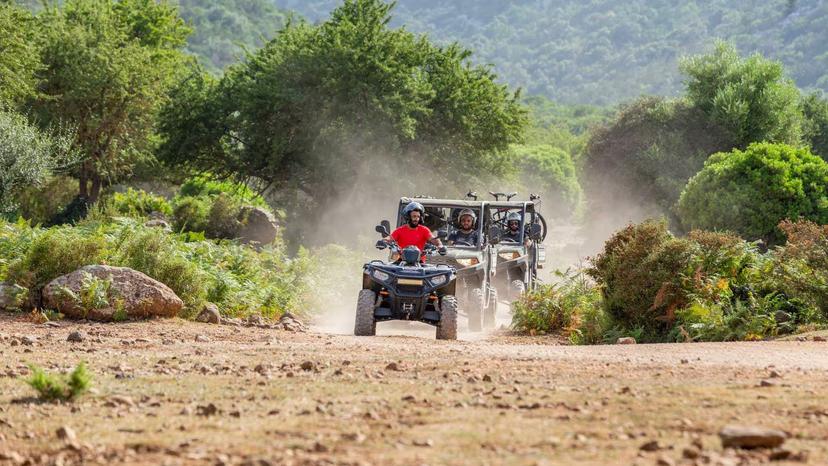 Adventurous buggy tour through lush landscapes near Baunei heading towards Punta Salinas.
