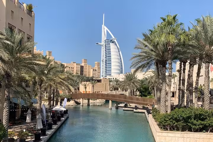 Burj Al Arab view from Madinat Jumeirah canal, scenic photo stop on multi day Dubai to Abu Dhabi tour