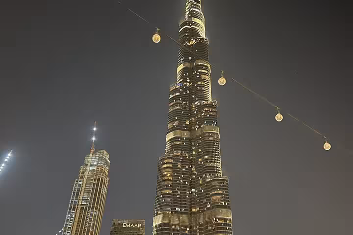Burj Khalifa illuminated after dark, iconic skyline view on a private Dubai by night tour