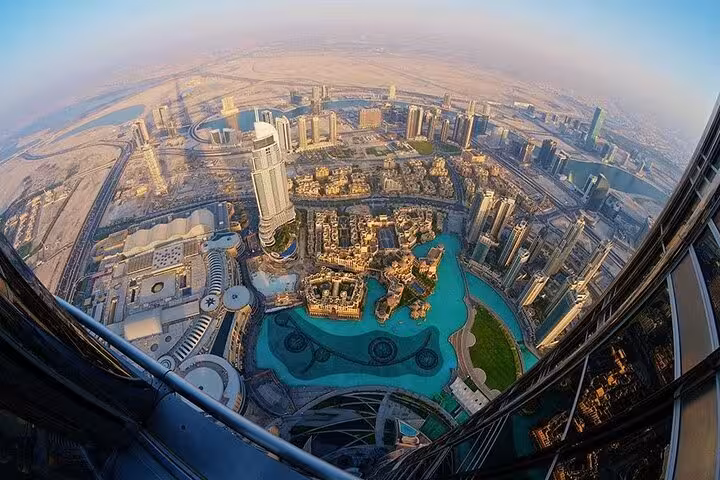 Panoramic view from Burj Khalifa At The Top over Downtown Dubai and Dubai Fountain lake, UAE