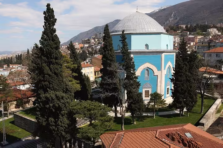 Panoramic view of Bursa’s Green Tomb and hillside skyline, featured on Istanbul Bursa & Uludag cable car tour