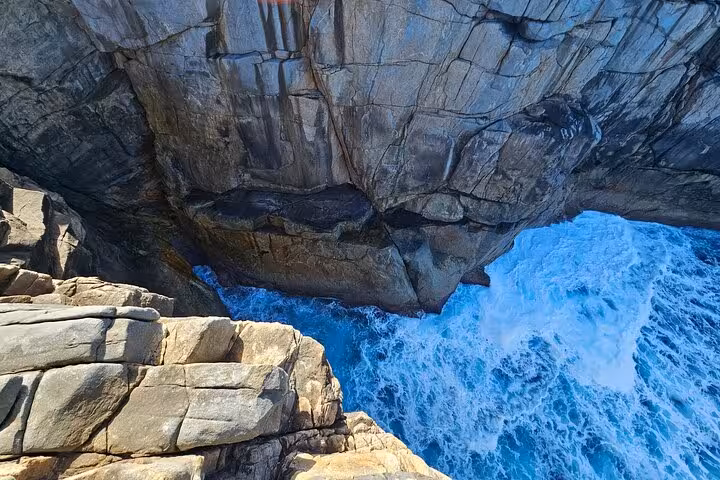 Breathtaking coastal cliffs meeting turquoise waves on the Busselton Jetty to Valley of the Giants tour.
