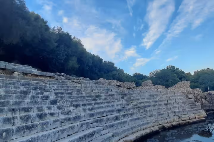 Visit the ancient amphitheater in Butrint National Park, Albania, a highlight on your 6-day cultural tour.