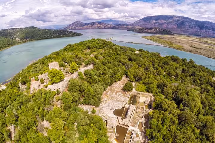 Aerial view of Butrint National Park's ancient ruins and lush landscape, perfect for exploring on a guided tour.