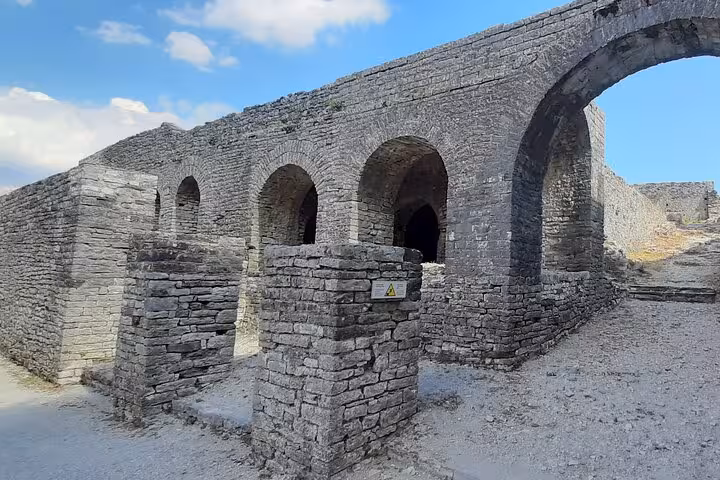 Explore ancient stone arches at Butrint, a UNESCO World Heritage site, on your 6-day tour of Albania.
