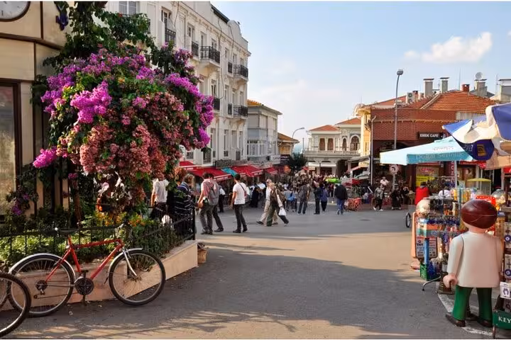 Büyükada market square with cafes and flowers, lively scene on Istanbul Princes Islands tour from Istanbul