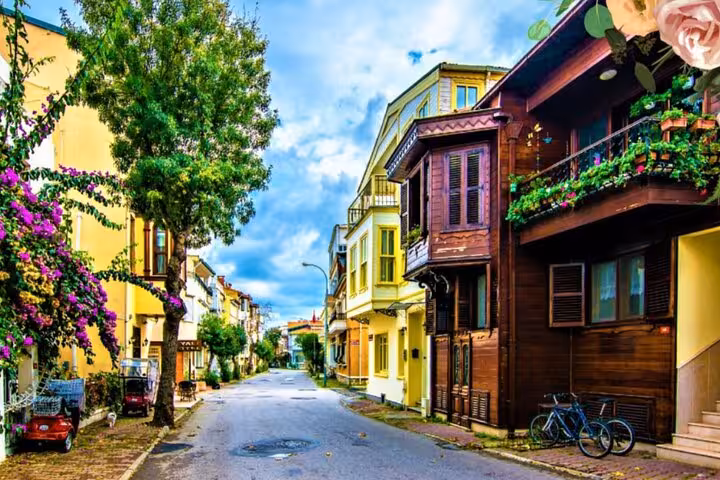 Colorful Büyükada street with historic wooden houses and flowers on Istanbul Princes Islands tour