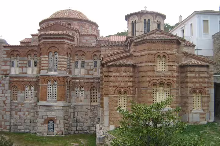 Historic Byzantine church near Delphi with brick domes and arched windows, Delphi and Meteora two-day tour