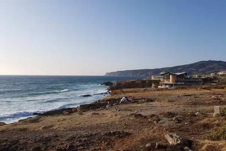 Scenic coastal view of Cabo da Roca's rugged cliffs and ocean waves, featured on the Sintra, Cascais private tour from Lisbon.