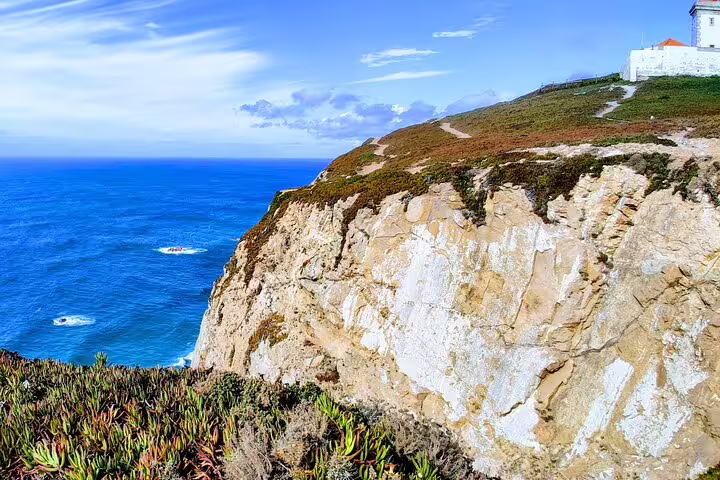 Scenic view of Cabo da Roca's cliffs and Atlantic Ocean on a private tour from Lisbon to Sintra's Pena and Regaleira palaces.