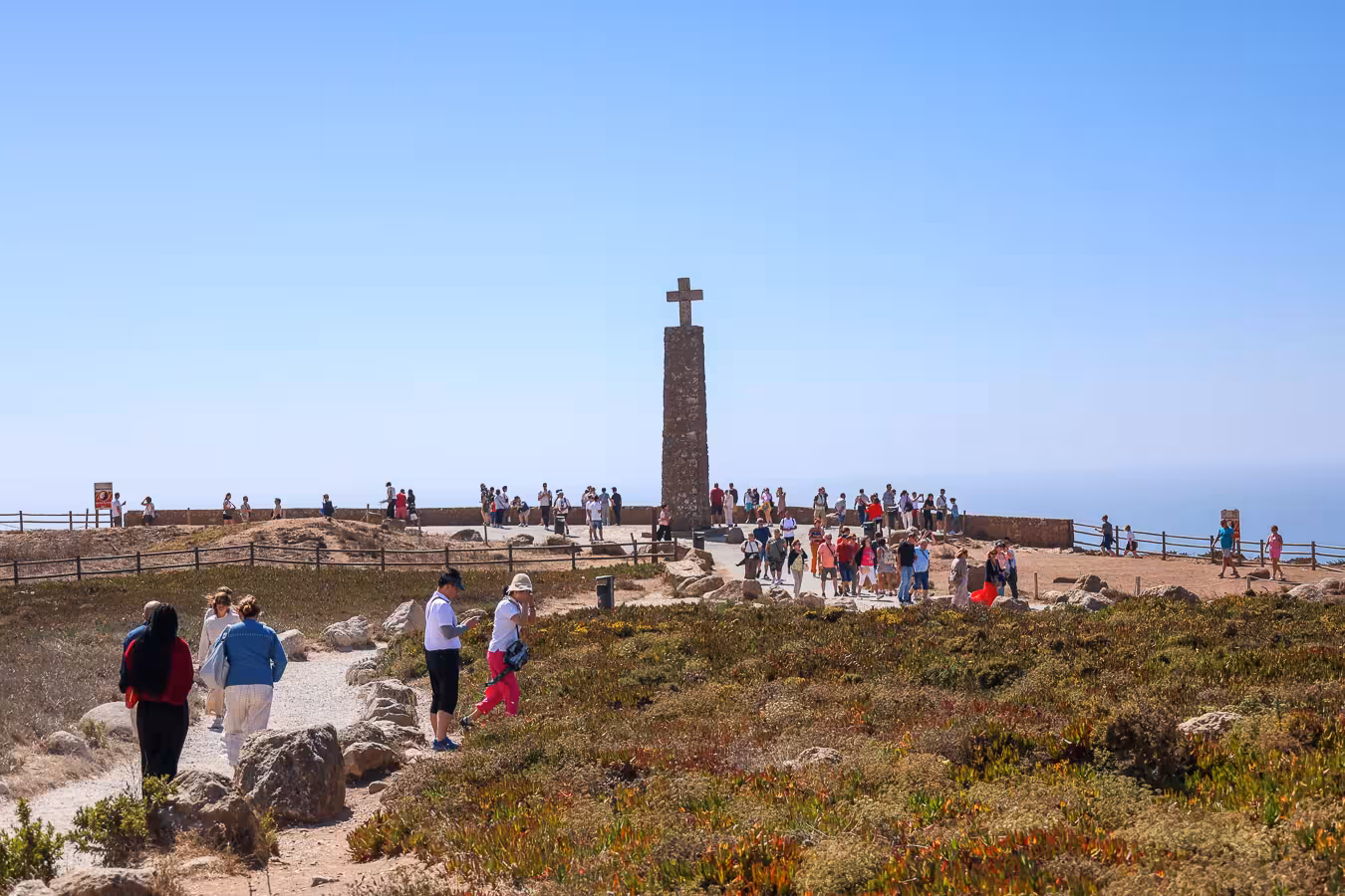 Tourists gather near the iconic stone cross at Cabo da Roca, the westernmost point of mainland Europe.