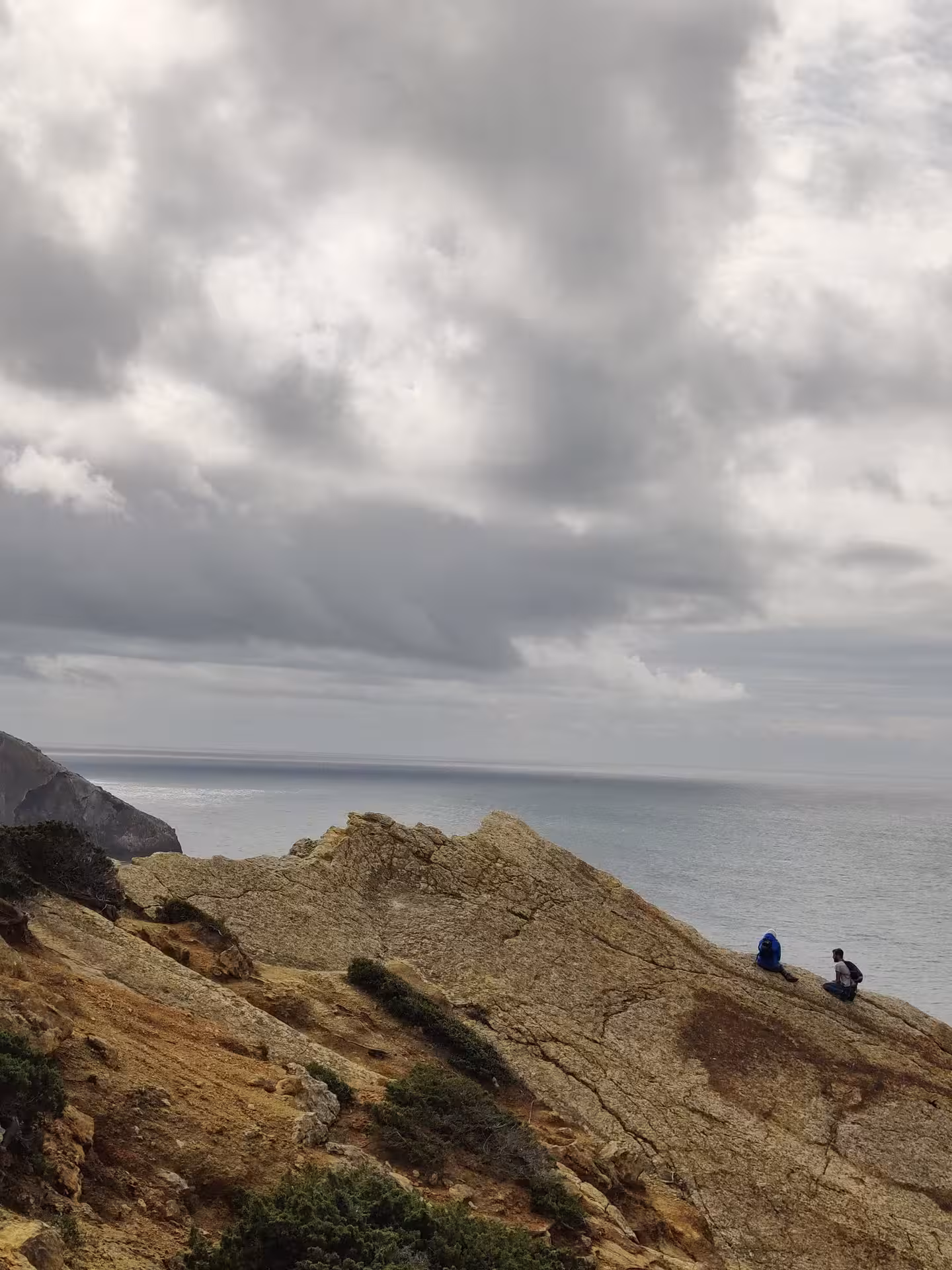 Rest stop on rugged Cabo Espichel cliffs with Atlantic views during the guided dinosaur footprints hike
